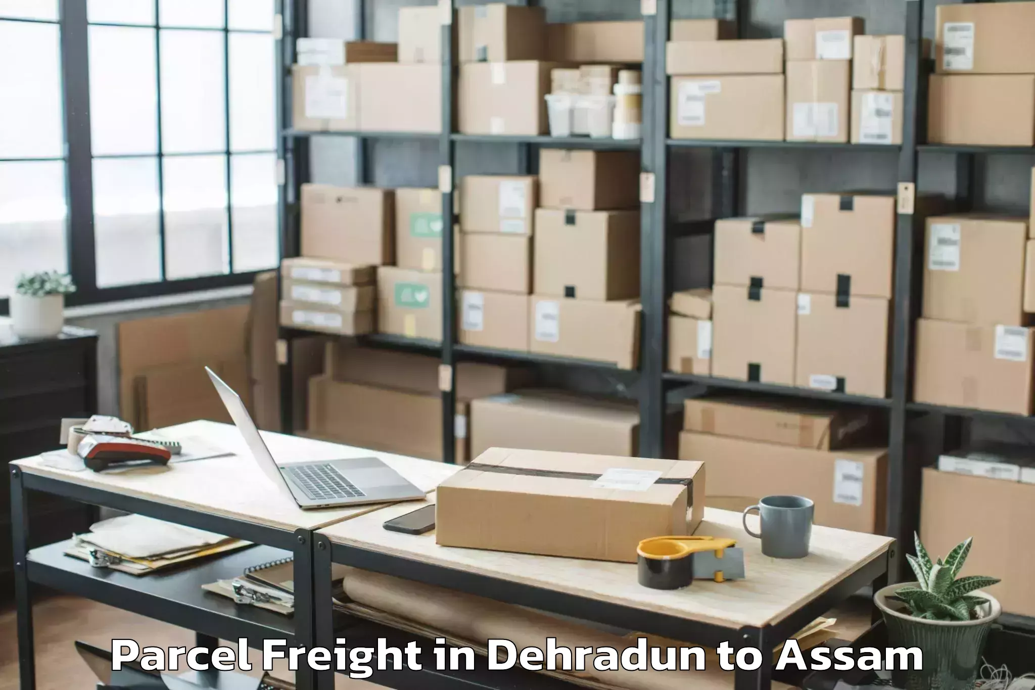 Book Dehradun to Bokolia Parcel Freight Online